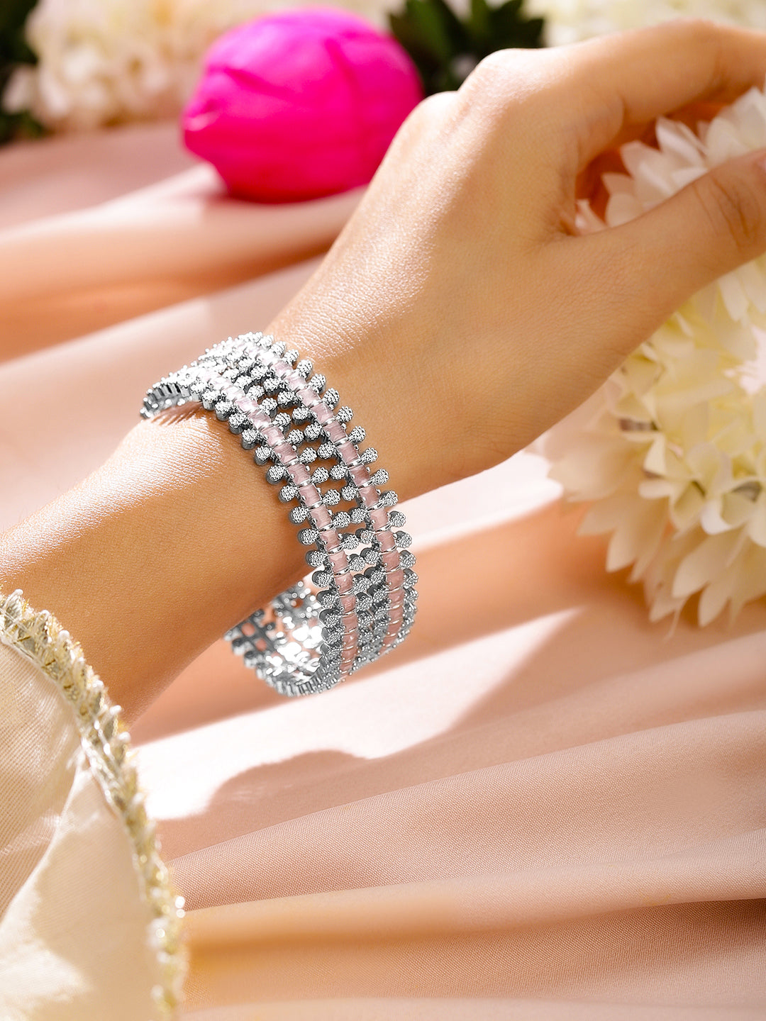 Rhodium-plated bangles adorned with pastel pink and white cubic zirconia Glow Chandelier