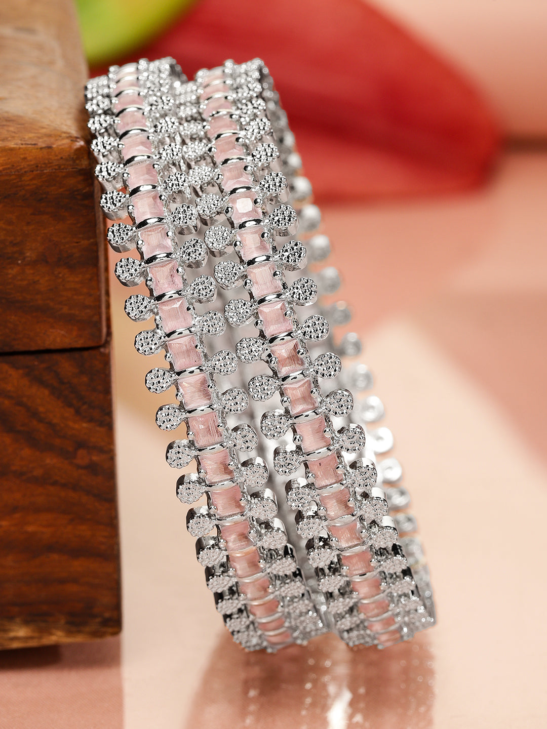 Rhodium-plated bangles adorned with pastel pink and white cubic zirconia Glow Chandelier