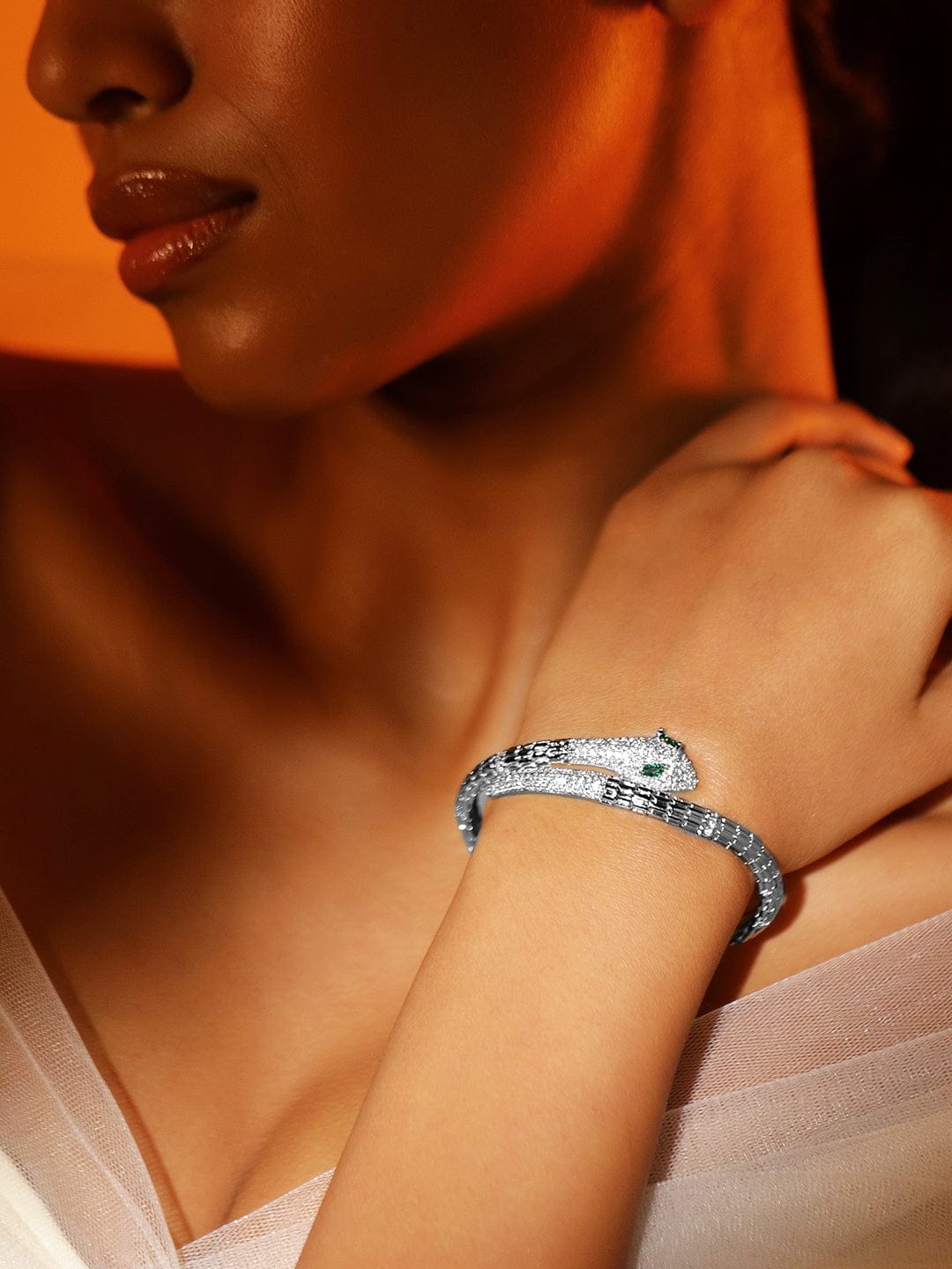Rubans Rhodium-Plated Cubic Zirconia Snake-Inspired Openable Bracelet with Emerald Accents