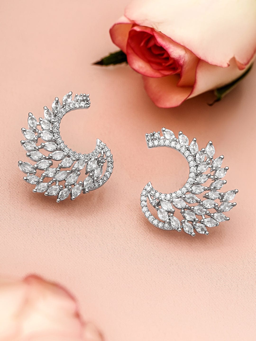 Rubans Rhodium Plated White Cubic Zirconia Studded Handcrafted Feather Shaped Statement Stud Earrings