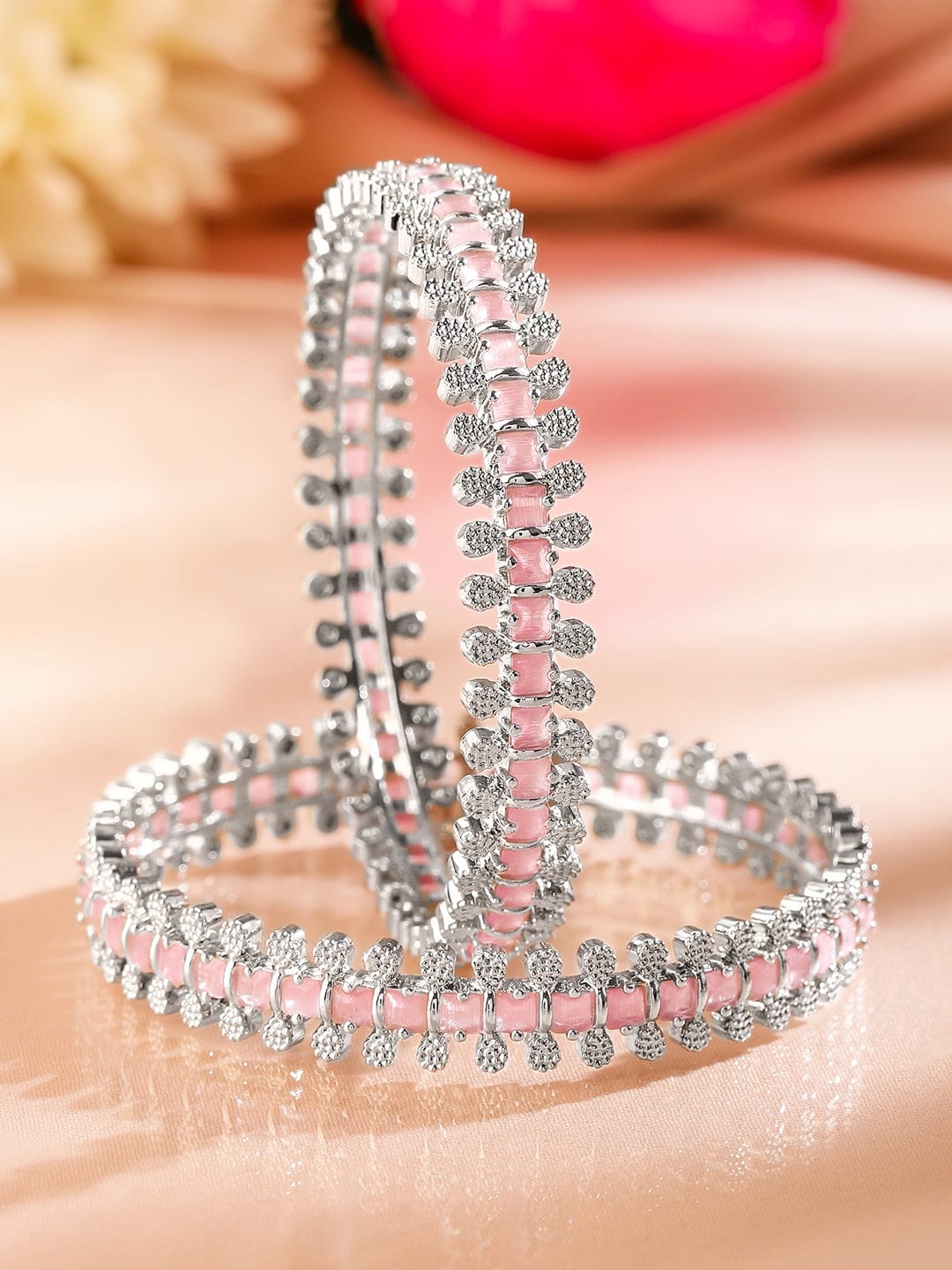 Rhodium-plated bangles adorned with pastel pink and white cubic zirconia Glow Chandelier